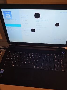 Toshiba Black Laptop with Matte Black Keyboard and Black Screen